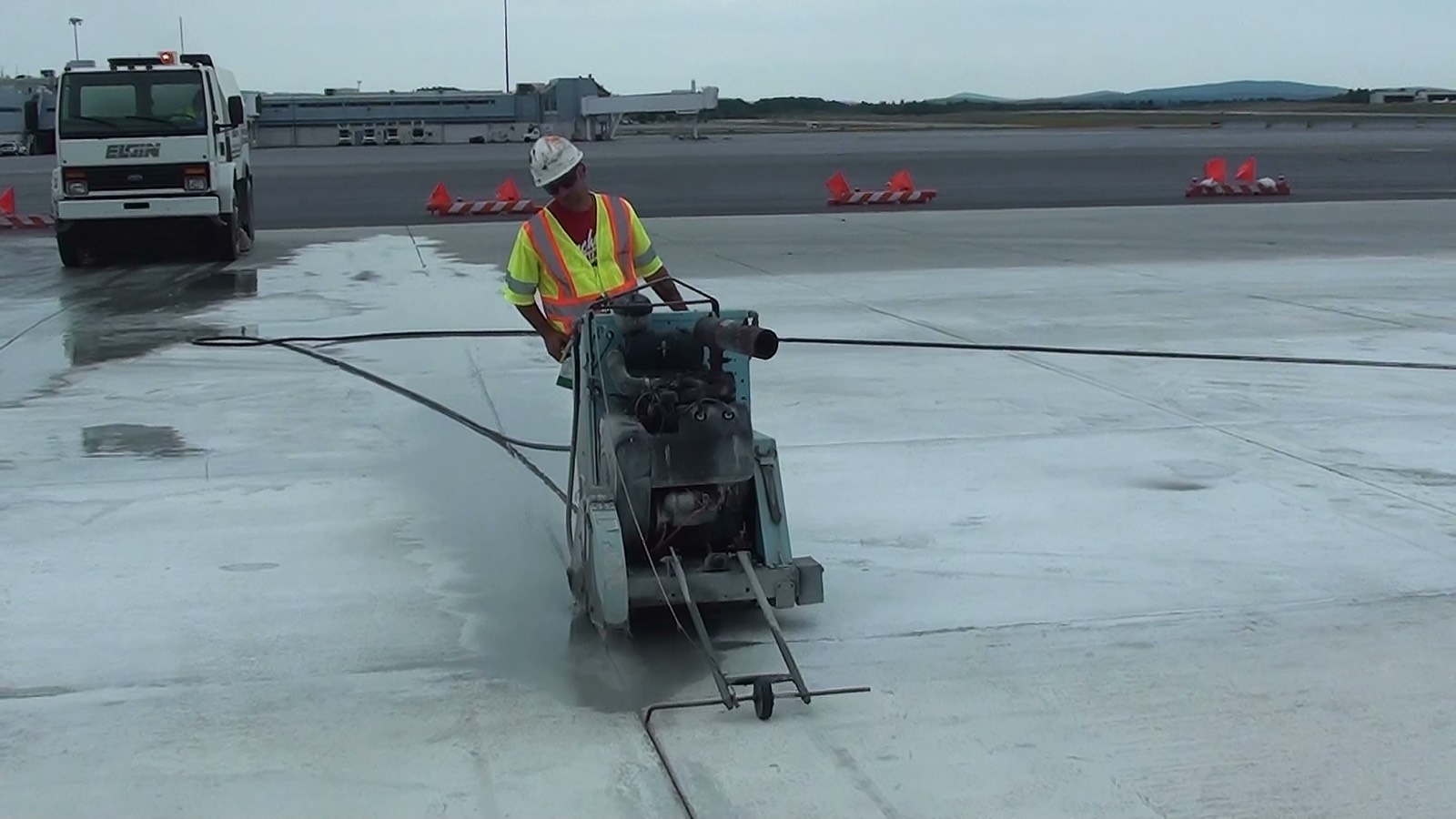 Sawcutting and joint sealing equipment on pavement